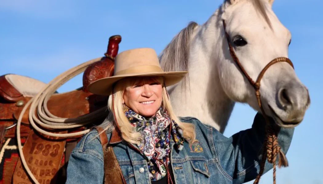 Jo’Ann Montana Cowgirl with horse in landscape