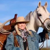 Jo’Ann Montana Cowgirl with horse in landscape